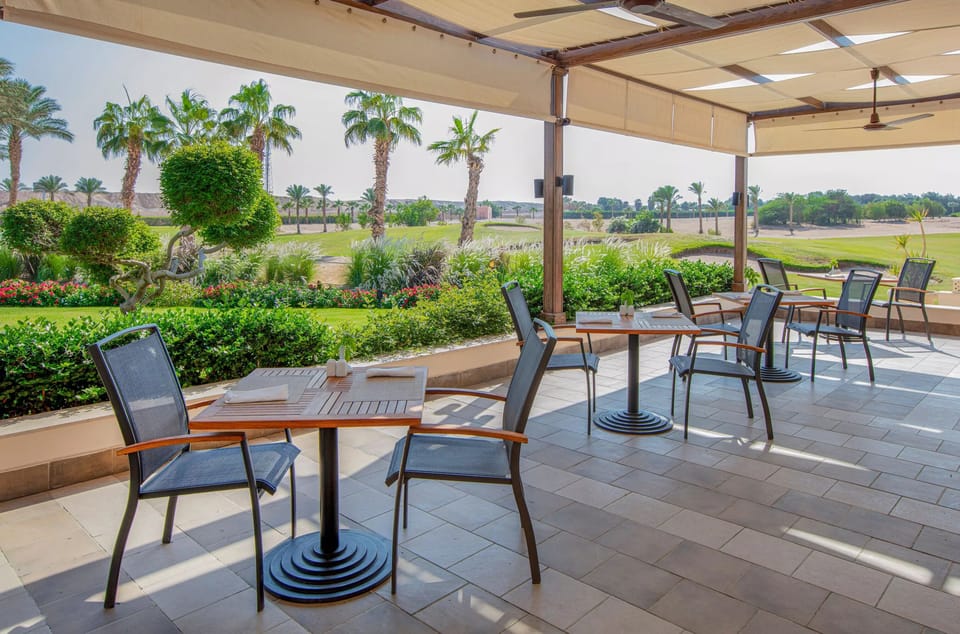 Linger over lunch on the shaded terrace amid lush gardens.
