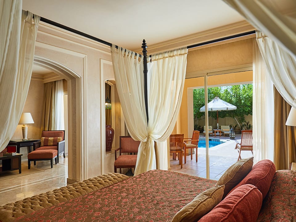 Wake up in a romantic canopy bed with poolside views.