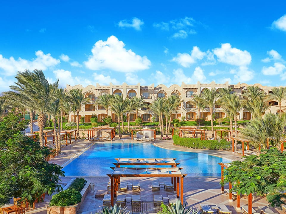 Dive into sunlit serenity with sweeping resort pool views.