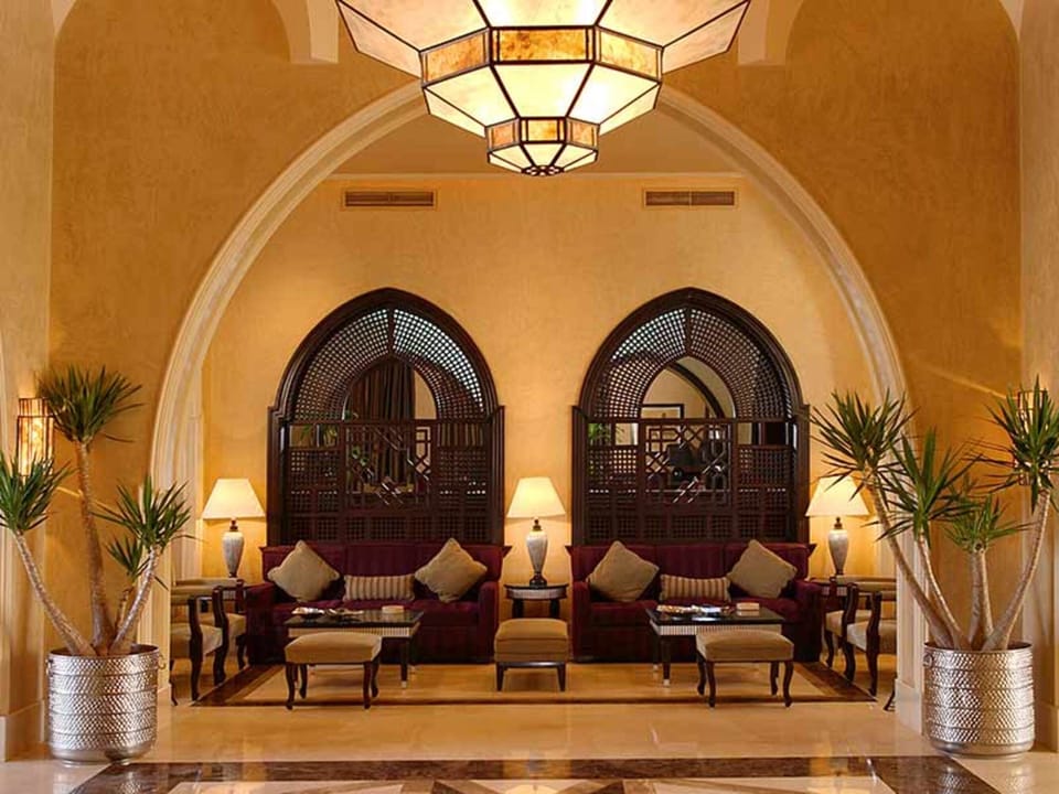 Unwind in the grand lobby lounge beneath warm ambient lighting.