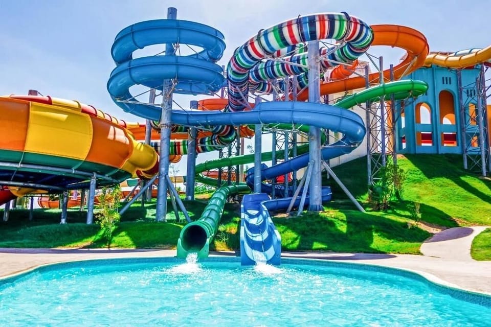 Soak up sunshine beside twisting slides and sparkling blue water.