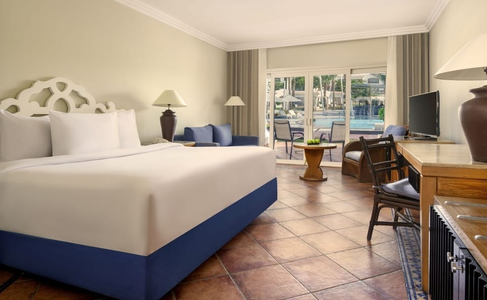 Wake up to pool views from your plush bed.