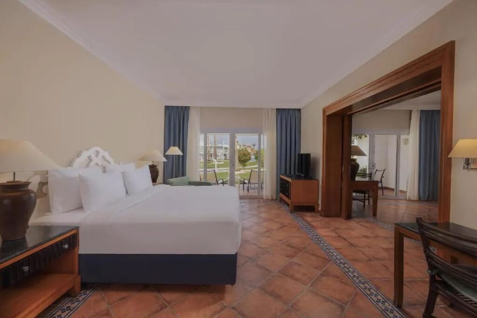 Relax in a calm, airy room with garden outlook.