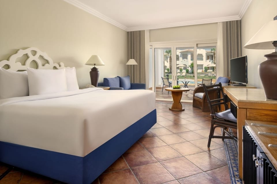 Stretch out in a serene king room with private patio seating.