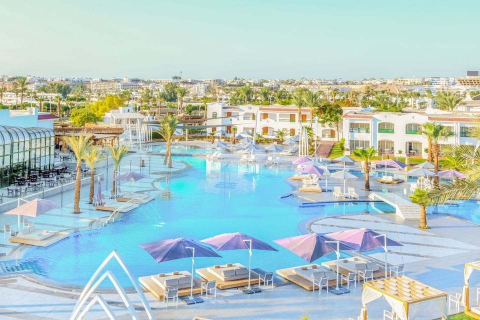 Float into a dreamy day across the sparkling blue poolscape.