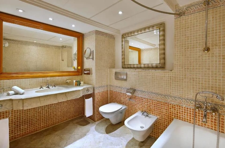 Refresh in a spa-like bathroom with bright, polished finishes.