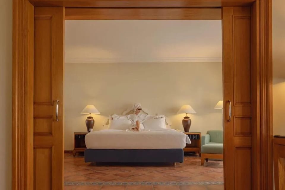 Enjoy extra space with a separate sitting area beyond.