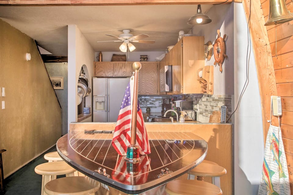 Centralized Location: Positioned in the open-concept living area, the table serves as a natural gathering point, complementing the nautical design. This one-of-a-kind dining table is the heart of the home, inviting guests to sit, share a meal