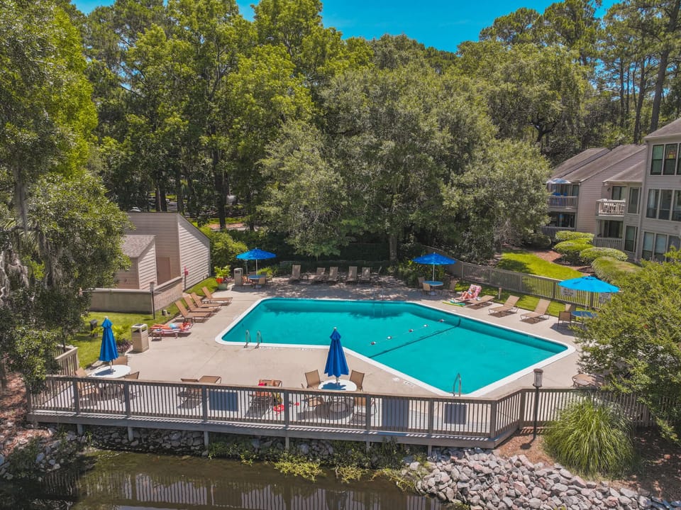 Lounge, relax, repeat. Comfortable seating and peaceful vibes await by the pool.