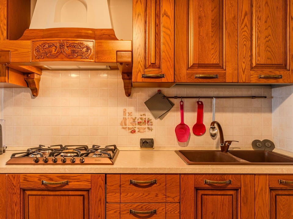 Wood, Kitchen, Flooring, Cabinetry, Interior Design, Countertop, Wood Stain, Major Appliance, Kitchen Stove, Orange
