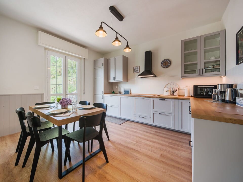 Furniture, Kitchen, Kitchen Appliance, Countertop, Interior Design, Cabinetry, Flooring, Wood, Ceiling, Kitchen & Dining Room Table