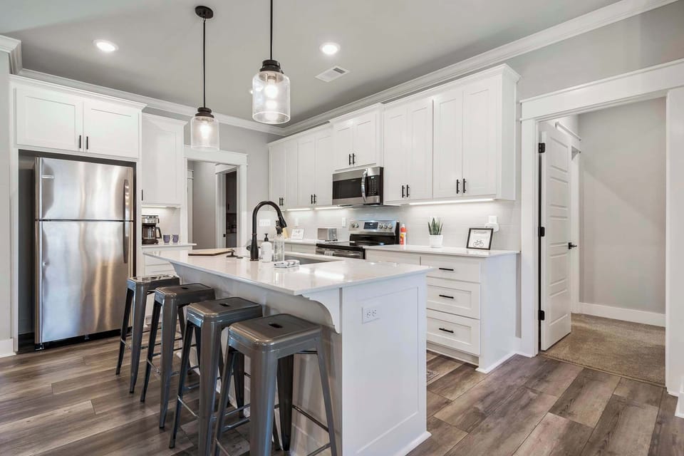 This modern kitchen is well stocked and equipped for your cooking needs.