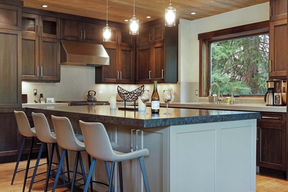 The chic, open kitchen offers ample space & every home comfort