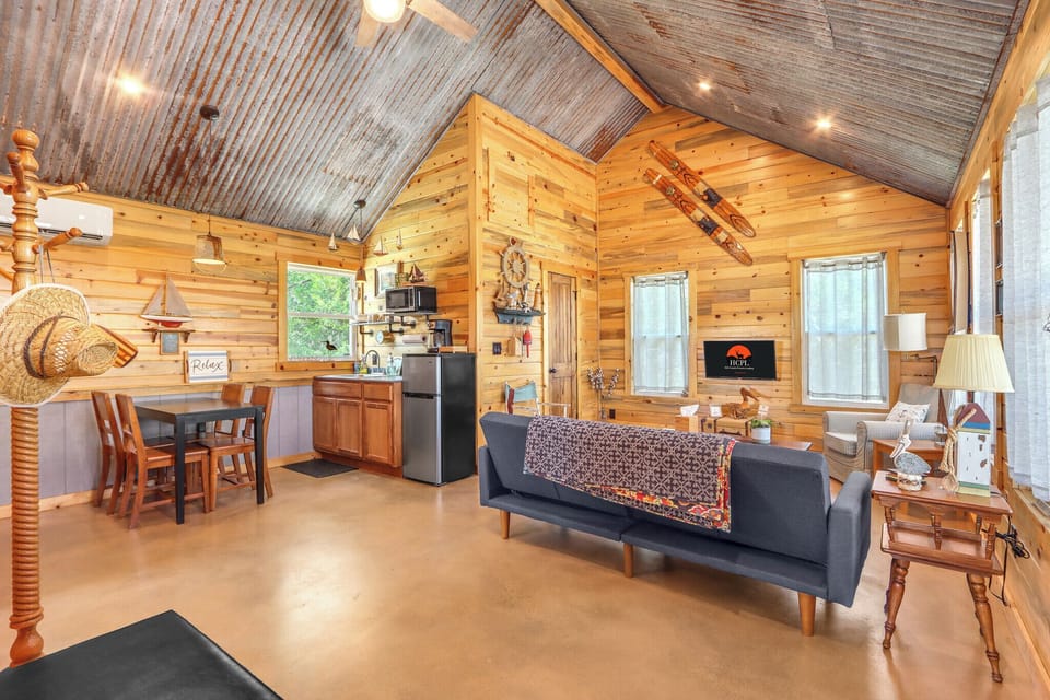 Open floor plan with living area, dining, and kitchenette.