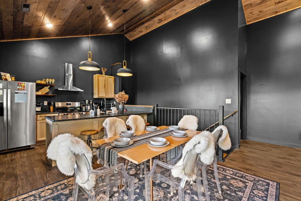 Clear dining chairs with wood table