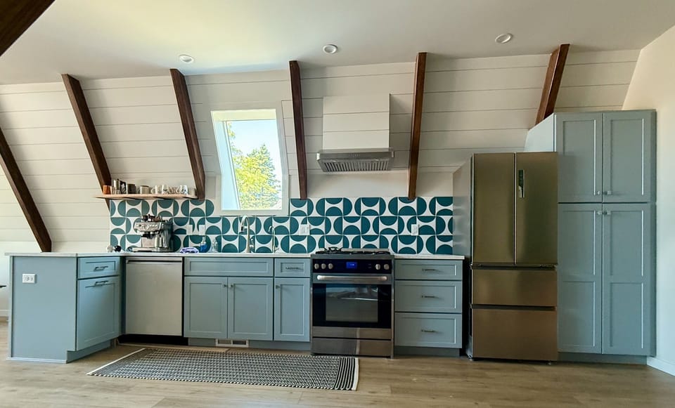 Fully stocked kitchen with stove, oven, refrigerator, dishwasher and microwave