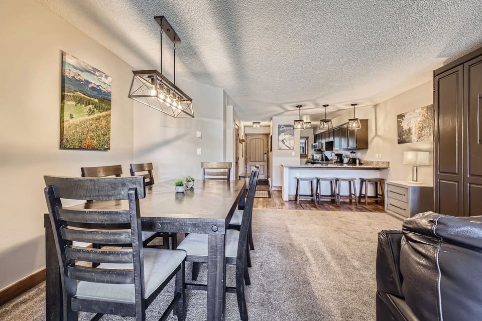Cozy dining space with plenty of natural light and a stunning balcony view — perfect for meals with a breeze and a view!