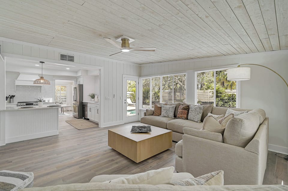 Family Room with open concept to Kitchen and door to Pool.