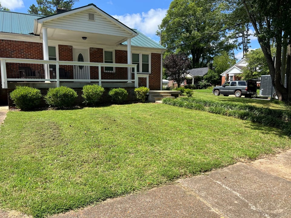 Front driveway, sits on corner lot.