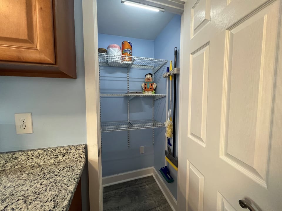 This kitchen pantry is big enough for you to unload your groceries. The light is motion activated.