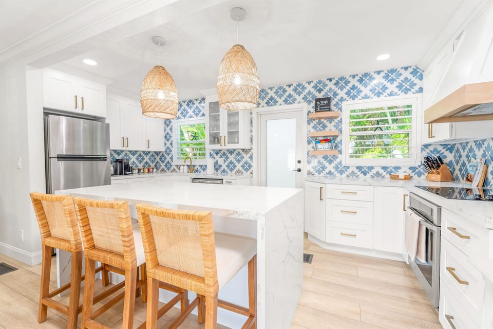 A chef’s dream. Fully equipped kitchen with expansive quartz countertops.