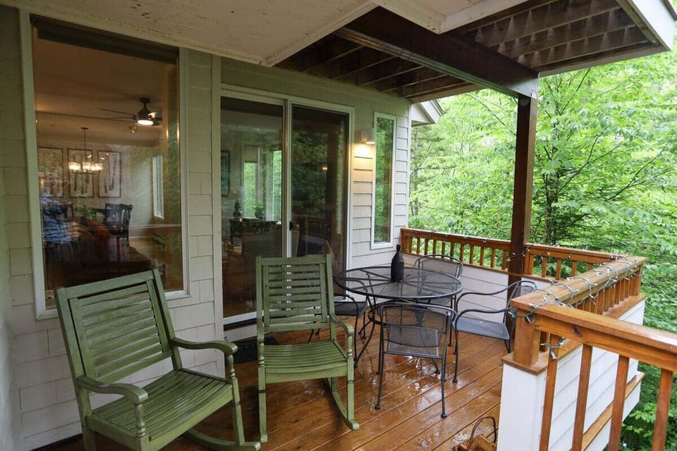 Deck with Living room and outside access at Forest Knoll Condo in Waterville Valley, NH.