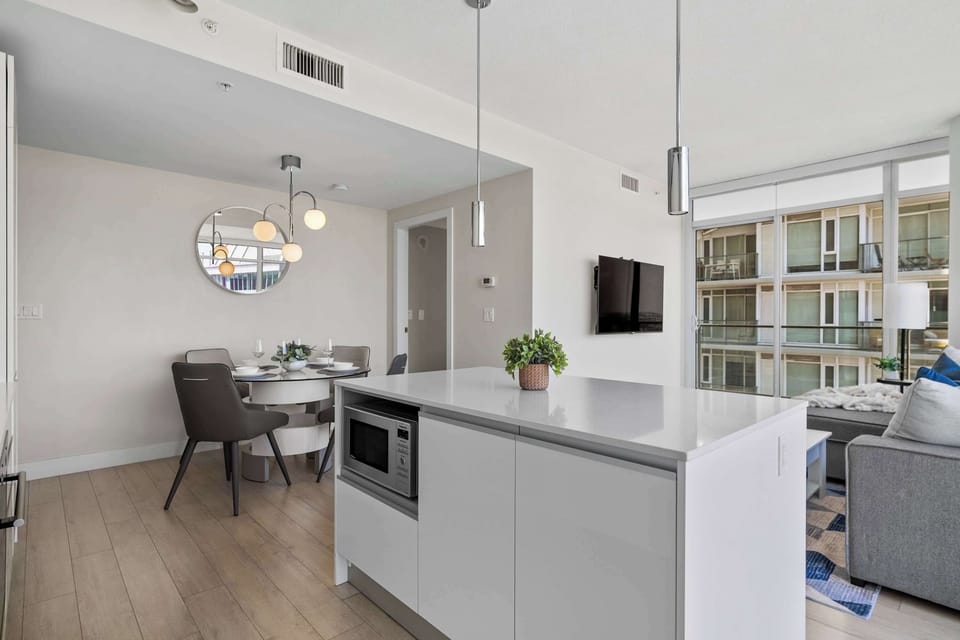 Island kitchen layout with stunning urban views