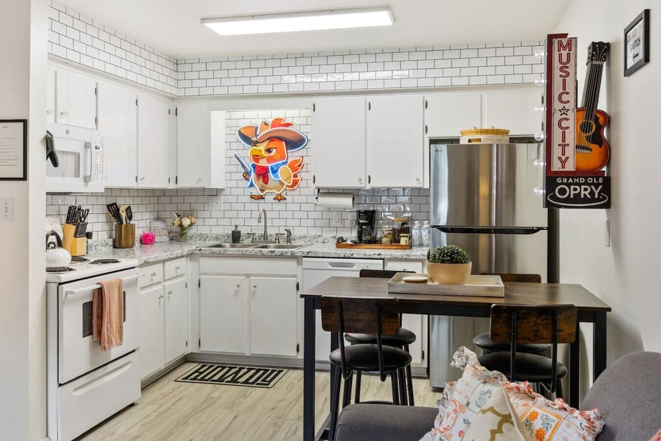 Fully-equipped kitchen with everything you'd need to make a great meal from the comfort of your condo, complete with all appliances, coffee grounds and a coffee machine. Seating for four at the dining table.