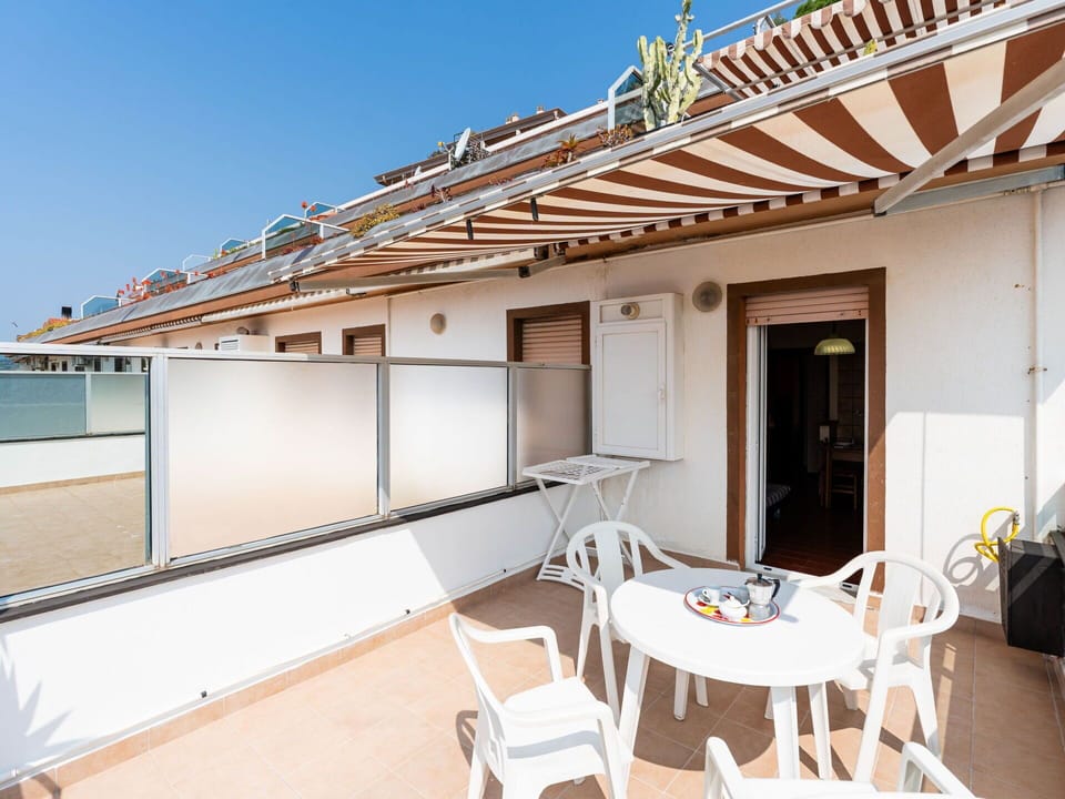 Furniture, Chair, Outdoor Furniture, Table, Outdoor Table, Kitchen & Dining Room Table, Umbrella, Shade, Restaurant, Patio