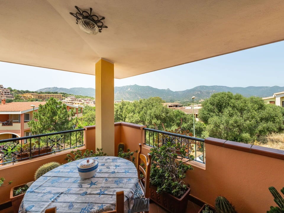 Furniture, Chair, Outdoor Furniture, Table, Outdoor Table, Kitchen & Dining Room Table, Umbrella, Shade, Restaurant, Patio