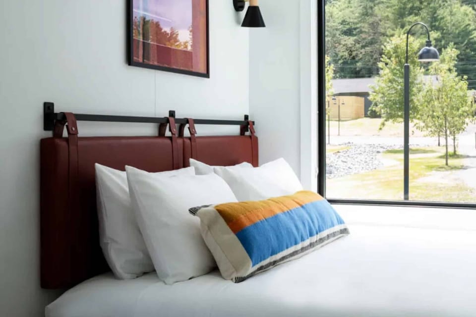 Sink into crisp linens and wake to peaceful views.