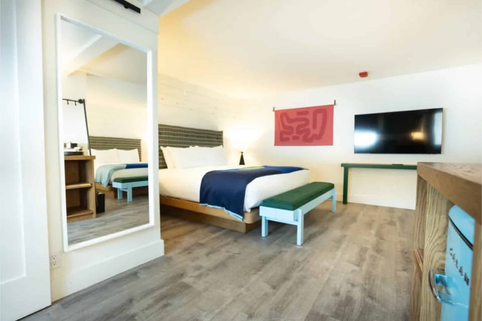 Stretch out in a spacious room with TV and vanity mirror.