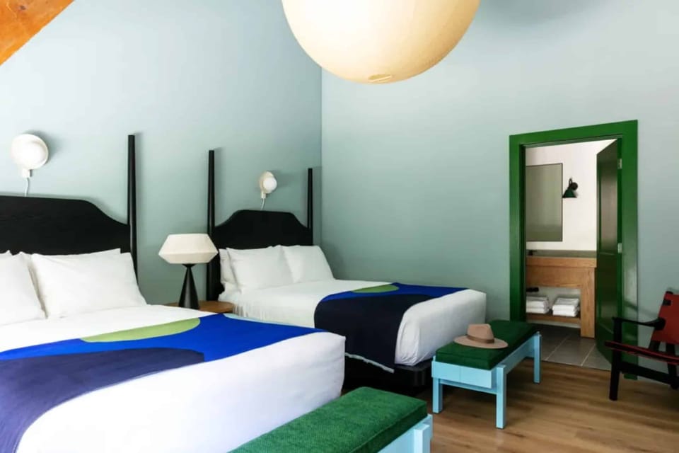 Settle in comfortably with twin beds and airy, modern style.
