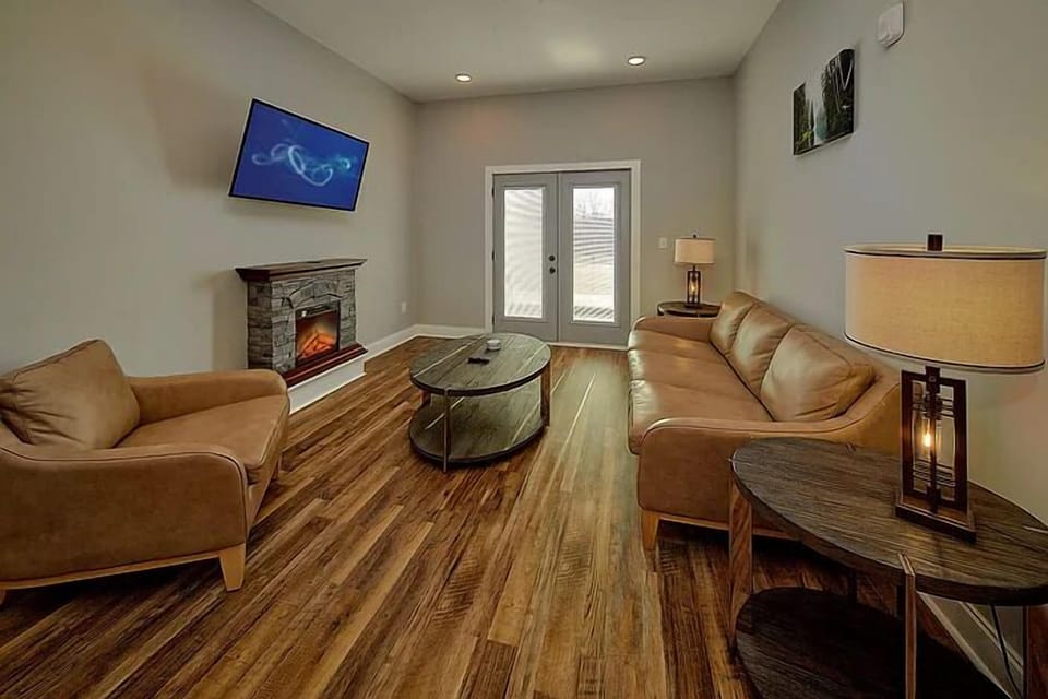 Spacious Living Room with Electric Fireplace and SMART TV with Cable & WIFI throughout vacation rental