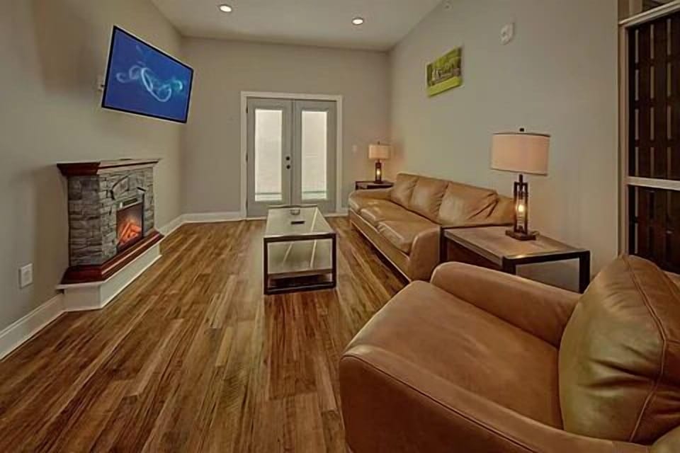 Spacious Living Room with Electric Fireplace and SMART TV with Cable & WIFI throughout vacation rental