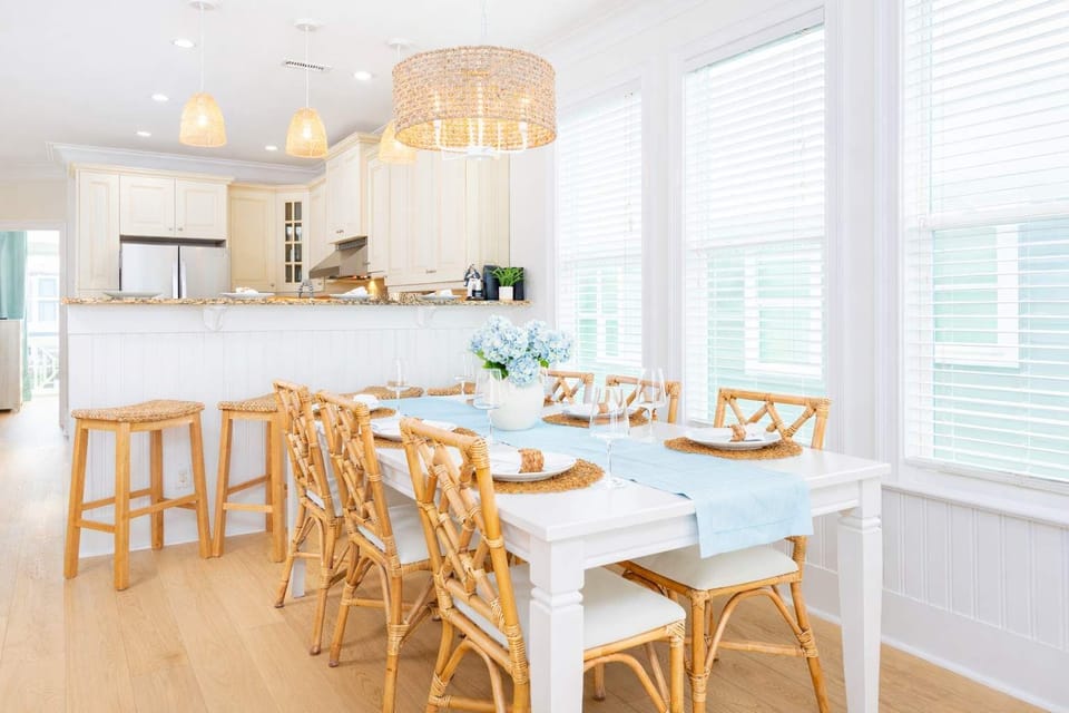 Coastal dining and kitchen elegance. Room to enjoy family or friends, games, and just hang out overlooking the ocean. High Chair provided, not in photo