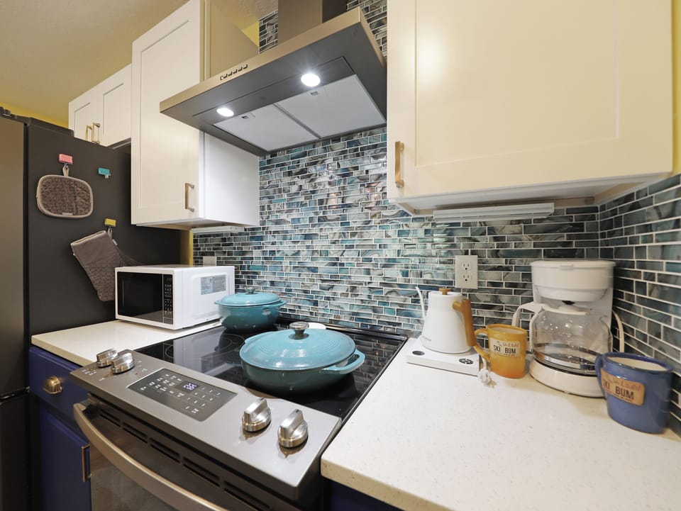 View of the galley kitchen with all the appliances necessary to enjoy a home cooked meal