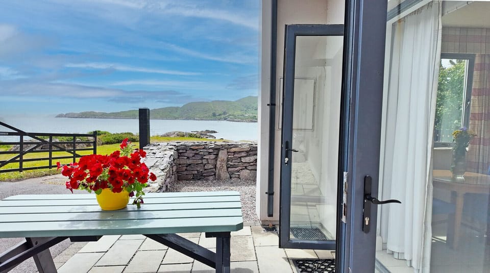 Derrynane Oceancove Holiday Homes Co Kerry. Family holiday accommodation. Outside dining with a view to the sea.