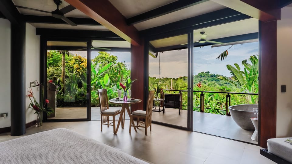 Indoor seating with panoramic jungle view