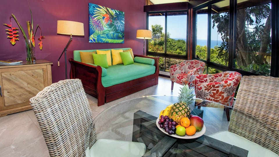 Living and dining areas with ocean and jungle views