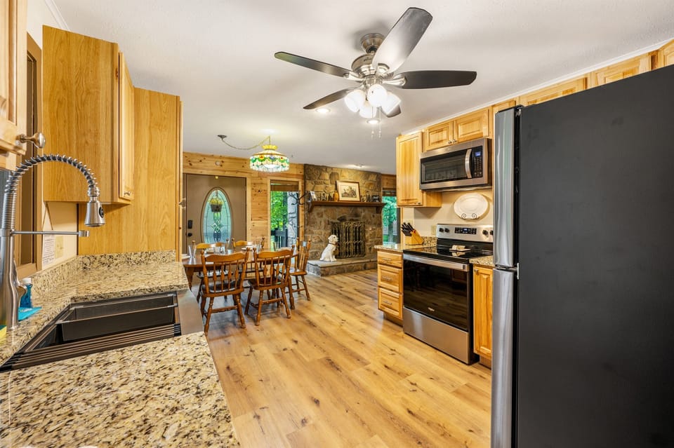 Another view of the kitchen highlights the open flow into the dining area—making it easy to cook, serve, and gather without feeling cramped or boxed in.