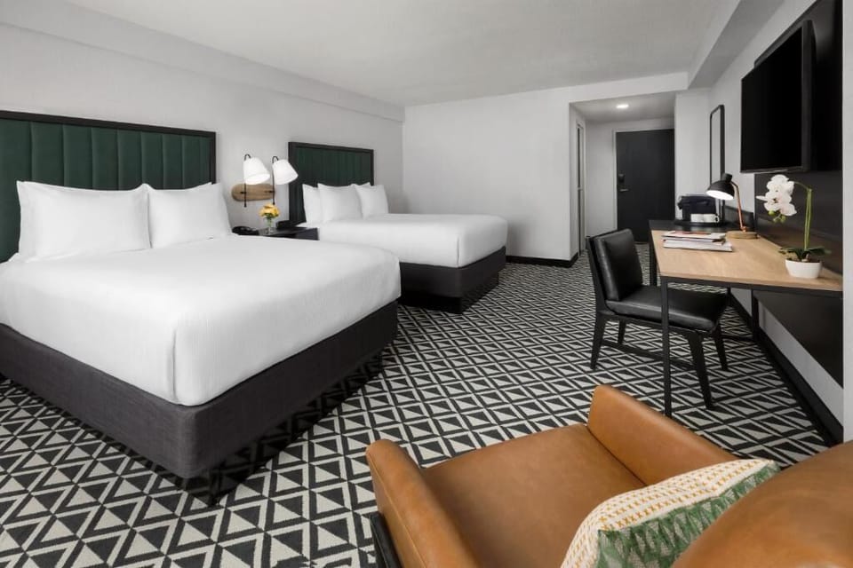 Stretch out in two queen beds with crisp linens.