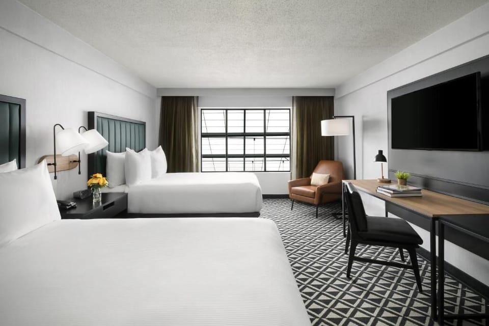 Settle in with bright natural light and crisp hotel bedding.