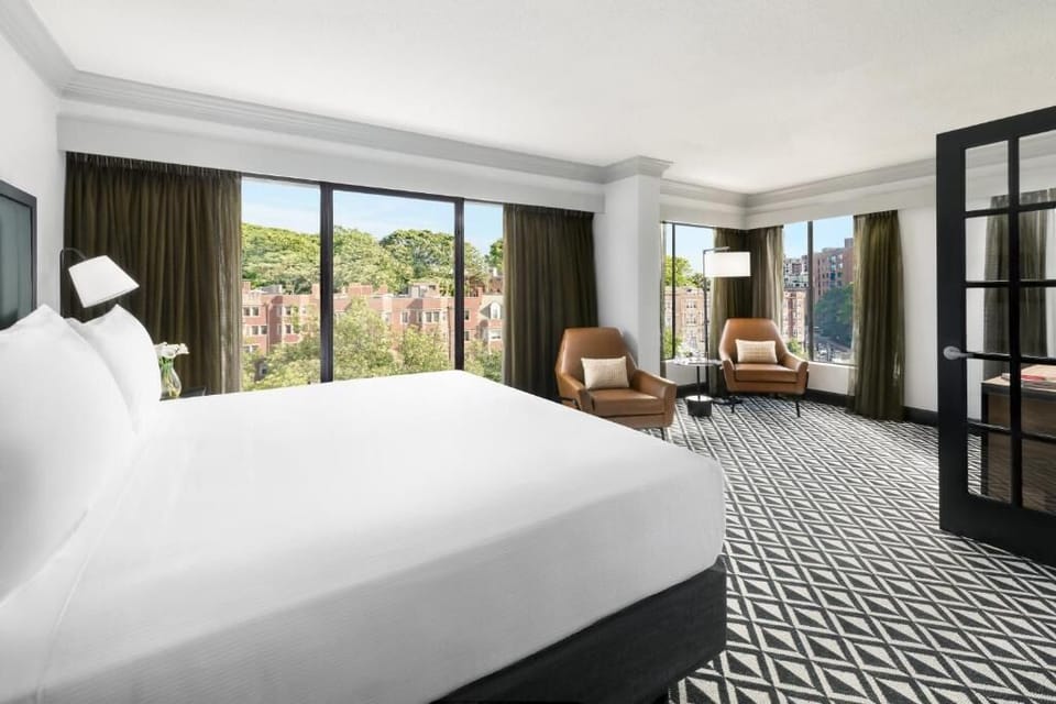 Wake up to sweeping skyline views from plush king bed.