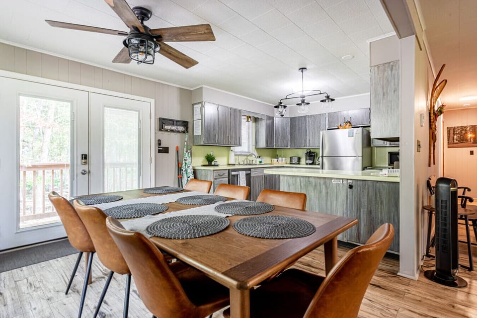 Spacious kitchen with modern appliances and an 8-seat dining table — perfect for family meals and group gatherings.