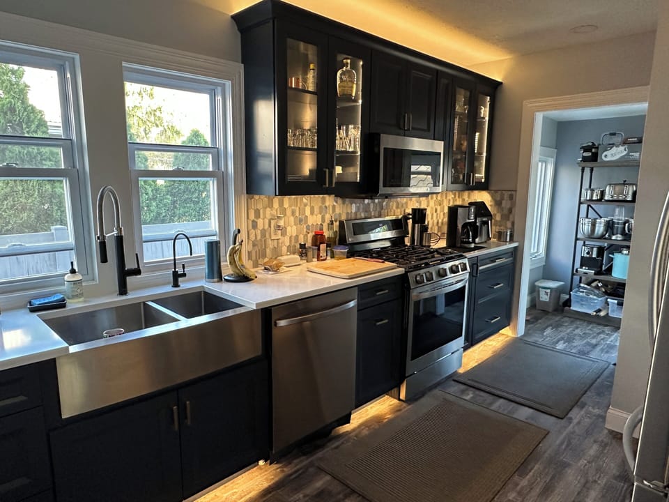 Modern kitchen with full appliances—shared space with host, perfect for cooking during your stay.