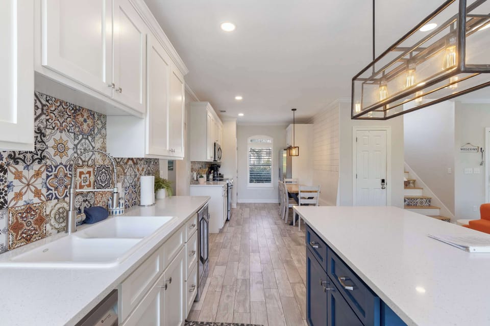 Kitchen: Main floor, drip coffee maker, Keurig, air fryer, Crockpot, toaster oven, blender, cooking utensils, tableware