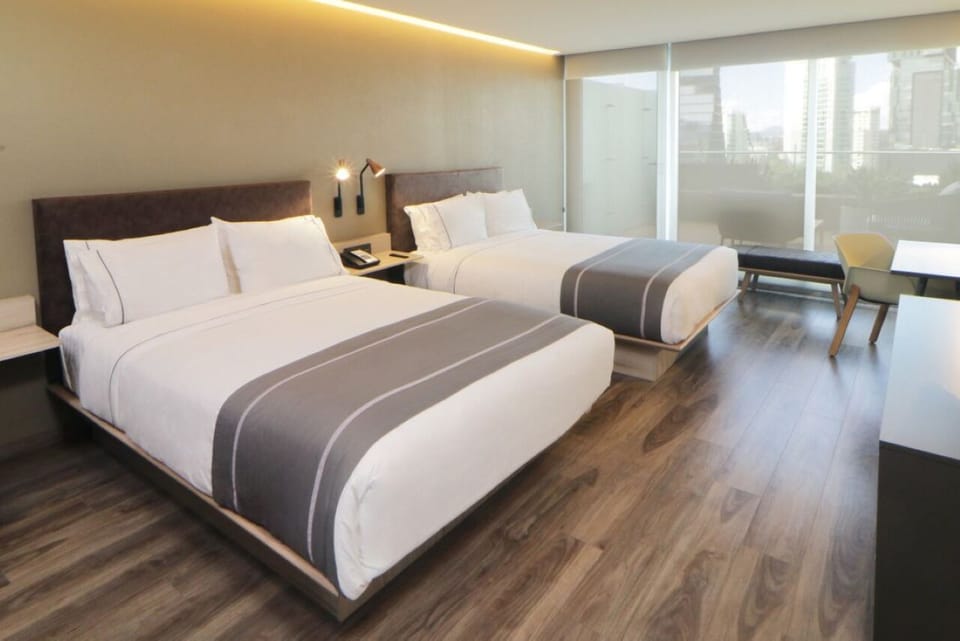 Stretch out comfortably with two plush beds and airy light.