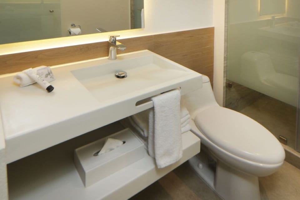Start the day at a bright vanity with fresh towels.