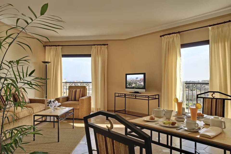 Gather for breakfast beside sunlit windows and open views.